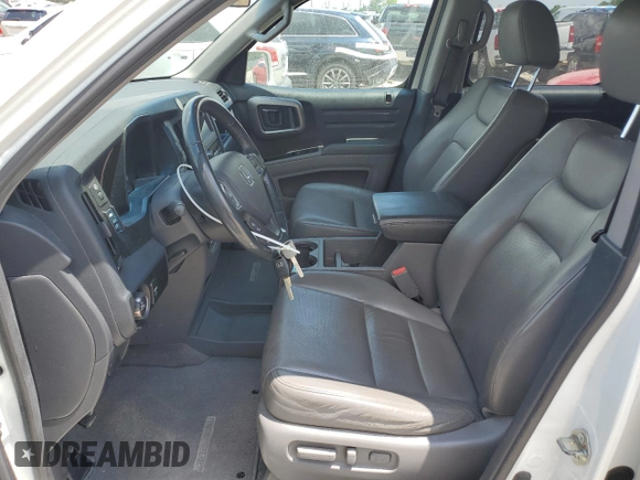 2012 Honda Ridgeline RTL with VIN 5FPYK1F56CB002709, listed as a Copart auction lot 62642495 with 116,416 mi miles and Salvage title. Bid and sale history available at DreamBid. Image 7.