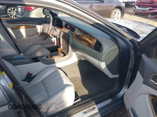 2003 Jaguar S-Type with VIN SAJEA01T23FM93839, listed as a IAAI auction lot 41891973 with 153,761 mi miles and . Bid and sale history available at DreamBid. Image 5.