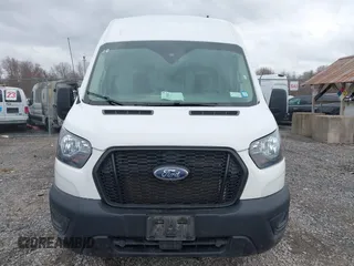 2023 Ford Transit Cargo with VIN 1FTBR3U89PKA07396, listed as a IAAI auction lot 41878907 with 103,402 mi miles and . Bid and sale history available at DreamBid. Image 6.