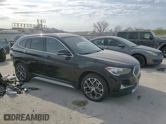 2020 BMW X1 xDrive28i with VIN WBXJG9C06L5P89796, listed as a Copart auction lot 52817235 with 95,665 mi miles and Salvage title. Bid and sale history available at DreamBid. Image 12.