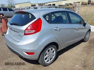 2013 Ford Fiesta SE with VIN 3FADP4EJ9DM157685, listed as a IAAI auction lot 42145511 with 101,331 mi miles. Bid and sale history available at carsss.com. Image 4.