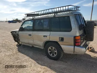 1998 Mitsubishi Montero z VIN JA4MR51R0WJ000921, wystawiony jako Copart lot #56250965 z przebiegiem 181 293 mil mil oraz Szkoda całkowita • Salvage title. Historia ofert i sprzedaży dostępna na DreamBid. Obrazek 2.