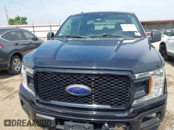2018 Ford F-150 XL with VIN 1FTEW1EP1JKD05142, listed as a IAAI auction lot 42473177 with 99,079 mi miles and . Bid and sale history available at DreamBid. Image 13.