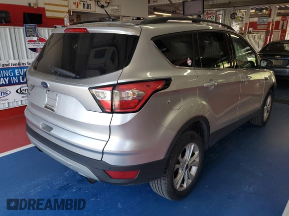 2018 Ford Escape SE z VIN 1FMCU9GD3JUC13075, wystawiony jako IAAI lot #42537659 z przebiegiem 77 270 mil mil oraz . Historia ofert i sprzedaży dostępna na DreamBid. Obrazek 30.