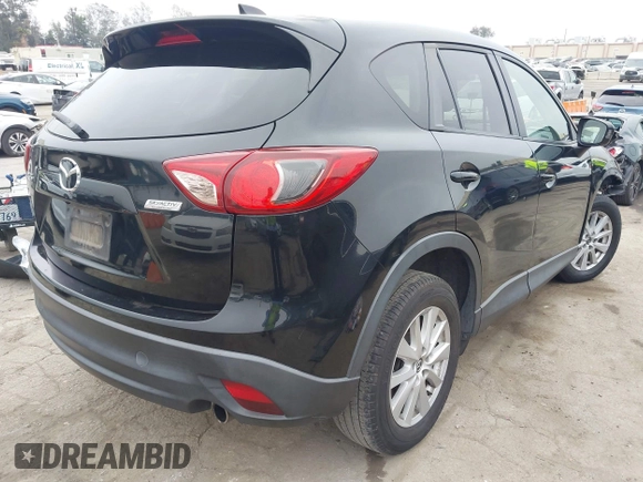 2014 Mazda CX-5 Touring z VIN JM3KE2CY3E0355332, wystawiony jako IAAI lot #42096306 z przebiegiem 108 198 mil mil oraz . Historia ofert i sprzedaży dostępna na DreamBid. Obrazek 4.