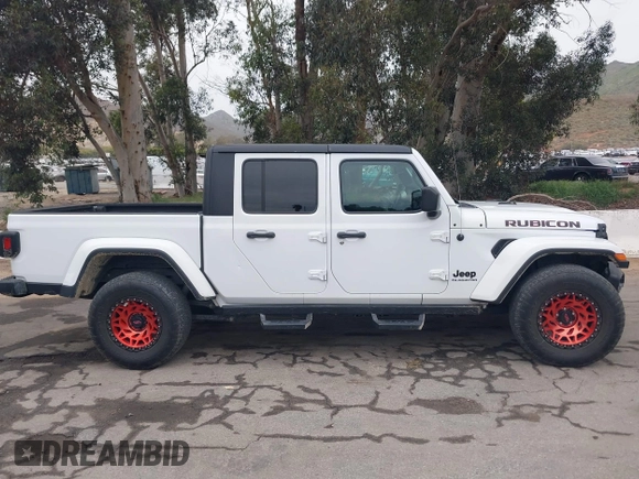 2021 Jeep Gladiator Willys with VIN 1C6HJTAG1ML572638, listed as a IAAI auction lot 42065562 with 43,040 mi miles and . Bid and sale history available at DreamBid. Image 13.