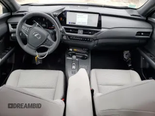 2025 Lexus UX with VIN JTHUCJDH5S2003058, listed as a Copart auction lot 43457505 with 1,239 mi miles and Salvage Title. Bid and sale history available at carsss.com. Image 8.