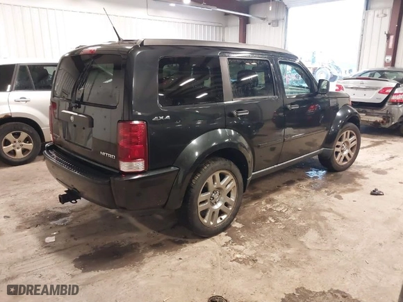 2011 Dodge Nitro Heat with VIN 1D4PU4GX0BW517654, listed as a IAAI auction lot 41715627 with 107,954 mi miles. Bid and sale history available at carsss.com. Image 4.