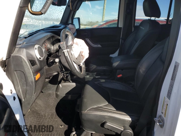 2017 Jeep Wrangler Unlimited Rubicon Recon with VIN 1C4HJWFG9HL543266, listed as a Copart auction lot 87771705 with 50,223 mi miles and Salvage title. Bid and sale history available at DreamBid. Image 7.