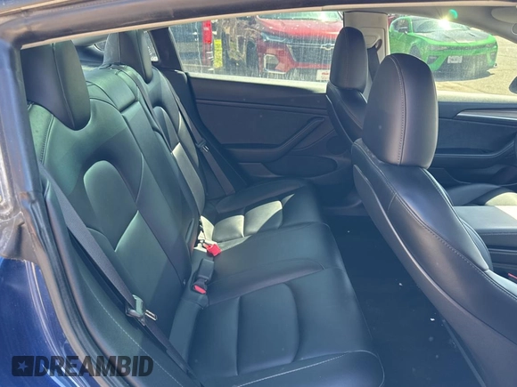 2023 Tesla Model 3 Long Range with VIN 5YJ3E1EB1PF625677, listed as a Copart auction lot 52424245 with 12,817 mi miles and Salvage Title. Bid and sale history available at DreamBid. Image 6.