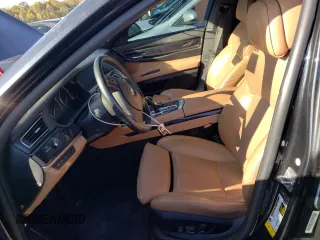 2011 BMW 7 Series with VIN WBAKX8C55BC198177, listed as a Copart auction lot 77016924 with 99,275 mi miles and Salvage title. Bid and sale history available at DreamBid. Image 7.