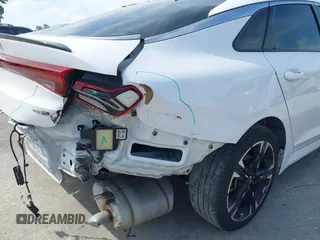 2022 Kia K5 GT-Line z VIN 5XXG64J24NG114772, wystawiony jako IAAI lot #42161747 z przebiegiem 60 761 mil mil oraz . Historia ofert i sprzedaży dostępna na DreamBid. Obrazek 6.