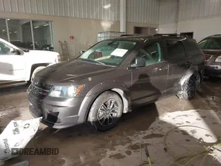 2018 Dodge Journey SE with VIN 3C4PDCAB1JT519745, listed as a IAAI auction lot 41366307 with 131,436 mi miles. Bid and sale history available at carsss.com. Image 2.