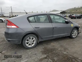 2010 Honda Insight EX with VIN JHMZE2H79AS017647, listed as a Copart auction lot 53311325 with 94,999 mi miles and Salvage Title. Bid and sale history available at DreamBid. Image 3.