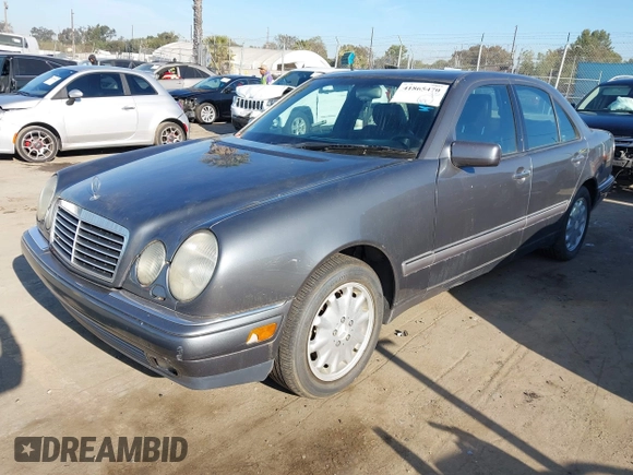 1997 Mercedes-Benz E 320 with VIN WDBJF55F7VA402305, listed as a IAAI auction lot 41865470 with 210,577 mi miles and . Bid and sale history available at DreamBid. Image 2.