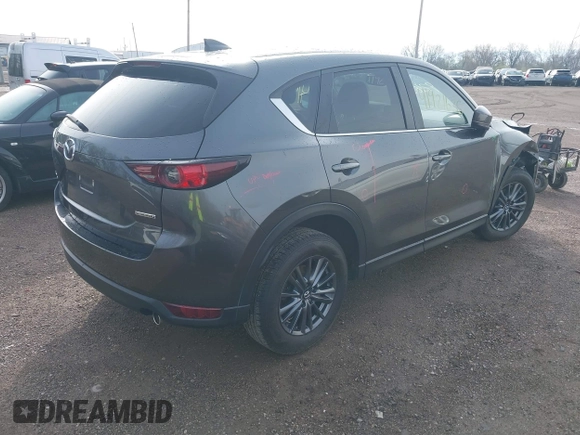 2020 Mazda CX-5 Touring with VIN JM3KFBCM8L0863951, listed as a IAAI auction lot 41921635 with 88,629 mi miles. Bid and sale history available at carsss.com. Image 4.