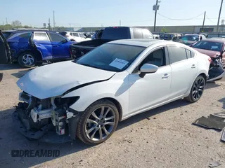 2016 Mazda Mazda6 i Grand Touring with VIN JM1GJ1W54G1456737, listed as a IAAI auction lot 41841001 with 114,870 mi miles. Bid and sale history available at carsss.com. Image 2.
