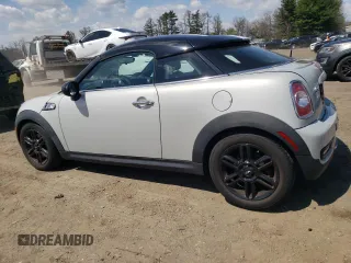 2012 MINI Coupe S z VIN WMWSX3C59CT465700, wystawiony jako Copart lot #52966245 z przebiegiem 136 253 mil mil oraz Szkody całkowita. Historia ofert i sprzedaży dostępna na DreamBid. Obrazek 2.