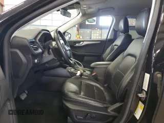 2021 Ford Escape SEL with VIN 1FMCU9H64MUA50988, listed as a Copart auction lot 54517685 with 122,593 mi miles and Salvage Title. Bid and sale history available at DreamBid. Image 7.