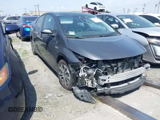 2022 Toyota Prius LE z VIN JTDKAMFP7N3205306, wystawiony jako IAAI lot #41647628 z przebiegiem 47 462 mil mil oraz . Historia ofert i sprzedaży dostępna na DreamBid. Obrazek 1.