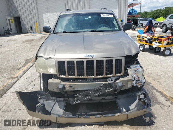 2005 Jeep Grand Cherokee Laredo with VIN 1J4HR48N65C608296, listed as a Copart auction lot 58862875 with 168,421 mi miles and Salvage title. Bid and sale history available at DreamBid. Image 5.