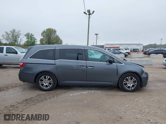 2013 Honda Odyssey EX z VIN 5FNRL5H47DB032096, wystawiony jako IAAI lot #42149190 z przebiegiem 149 836 mil mil oraz . Historia ofert i sprzedaży dostępna na DreamBid. Obrazek 13.