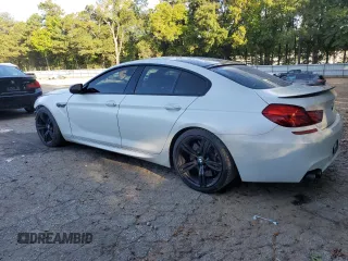 2016 BMW M6 z VIN WBS6E9C51GG437202, wystawiony jako Copart lot #71389434 z przebiegiem 80 673 mil mil oraz Szkoda całkowita • Salvage title. Historia ofert i sprzedaży dostępna na DreamBid. Obrazek 2.