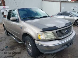 2003 Ford F-150 XLT with VIN 1FTRW07623KD34295, listed as a IAAI auction lot 41515387 with 163,506 mi miles. Bid and sale history available at carsss.com. Image 1.