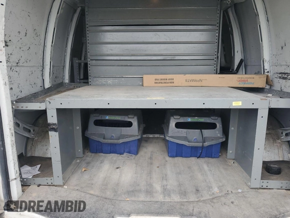 2014 Chevrolet Express Cargo with VIN 1GCWGFCA8E1121812, listed as a IAAI auction lot 42801147 with 128,506 mi miles and . Bid and sale history available at DreamBid. Image 2.