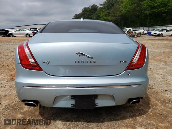 2013 Jaguar XJ with VIN SAJWA1C77D8V41738, listed as a Copart auction lot 53796225 with 104,063 mi miles and Salvage Title. Bid and sale history available at DreamBid. Image 6.