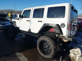 2014 Jeep Wrangler Unlimited Sahara with VIN 1C4HJWEG2EL273813, listed as a IAAI auction lot 41311011 with 96,104 mi miles. Bid and sale history available at carsss.com. Image 3.