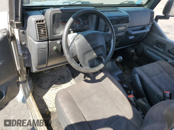 2003 Jeep Wrangler SE with VIN 1J4FA29183P335057, listed as a Copart auction lot 63523444 with 161,694 mi miles and Salvage title. Bid and sale history available at DreamBid. Image 8.