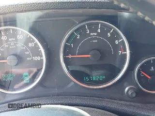 2014 Jeep Wrangler Unlimited Sport with VIN 1C4BJWDG4EL292421, listed as a IAAI auction lot 42034343 with 157,820 mi miles. Bid and sale history available at carsss.com. Image 7.
