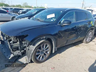 2020 Mazda CX-9 Grand Touring with VIN JM3TCADY0L0422548, listed as a IAAI auction lot 41839601 with 116,952 mi miles and . Bid and sale history available at DreamBid. Image 2.