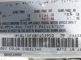 2011 Mazda Mazda3 i Sport with VIN JM1BL1UFXB1453950, listed as a IAAI auction lot 42180303 with 228,154 mi miles. Bid and sale history available at carsss.com. Image 9.