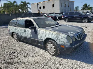 2001 Mercedes-Benz E-Class AWD with VIN WDBJH82J91X053532, listed as a Copart auction lot 82387664 with 116,737 mi miles and Salvage Title. Bid and sale history available at carsss.com. Image 4.
