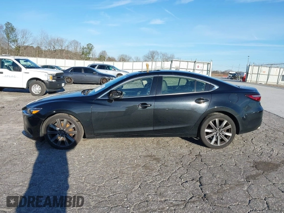 2018 Mazda Mazda6 Touring with VIN JM1GL1VM4J1307304, listed as a IAAI auction lot 41556563 with 173,739 mi miles. Bid and sale history available at carsss.com. Image 14.
