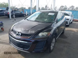2011 Mazda CX-7 i Touring with VIN JM3ER2CM0B0402889, listed as a IAAI auction lot 42040829 with 134,836 mi miles. Bid and sale history available at carsss.com. Image 2.