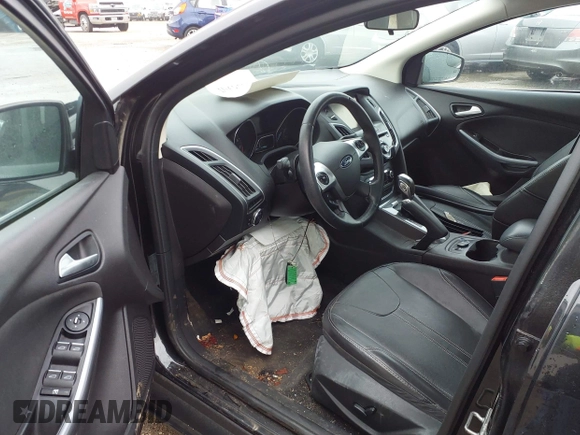 2014 Ford Focus Titanium with VIN 1FADP3J25EL310199, listed as a IAAI auction lot 40682901 with 84,885 mi miles and . Bid and sale history available at DreamBid. Image 12.