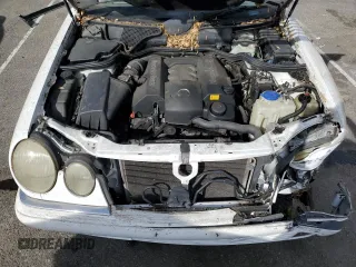 1999 Mercedes-Benz E-Class with VIN WDBJH65F3XA749696, listed as a Copart auction lot 77656084 with 163,802 mi miles and Salvage Title. Bid and sale history available at carsss.com. Image 11.