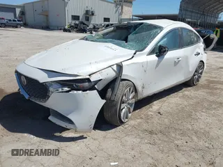 2021 Mazda 3 Select with VIN JM1BPABL0M1333705, listed as a IAAI auction lot 41819213 with 82,977 mi miles and . Bid and sale history available at DreamBid. Image 2.