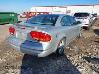 2004 Oldsmobile Alero GL1 z VIN 1G3NL52E94C189058, wystawiony jako IAAI lot #41224615 z przebiegiem 208 921 mil mil oraz . Historia ofert i sprzedaży dostępna na DreamBid. Obrazek 4.