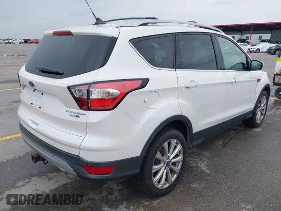 2018 Ford Escape Titanium with VIN 1FMCU9J98JUB87867, listed as a IAAI auction lot 42300123 with 48,357 mi miles and . Bid and sale history available at DreamBid. Image 4.