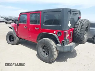 2015 Jeep Wrangler Unlimited Willys Wheeler with VIN 1C4BJWDG9FL750505, listed as a IAAI auction lot 41781762 with 139,000 mi miles and . Bid and sale history available at DreamBid. Image 3.