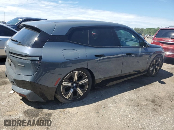 2022 BMW iX xDrive50 с VIN WB523CF00NCK44547, выставлен на аукционе Copart как лот 55262775 с пробегом 22 664 миль миль и Списание • Salvage title. История ставок и продаж доступна на DreamBid. Изображение 3.