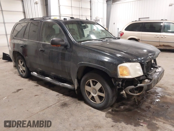2005 GMC Envoy SLT with VIN 1GKDT13S452349125, listed as a IAAI auction lot 41148381 with 224,049 mi miles. Bid and sale history available at carsss.com. Image 1.