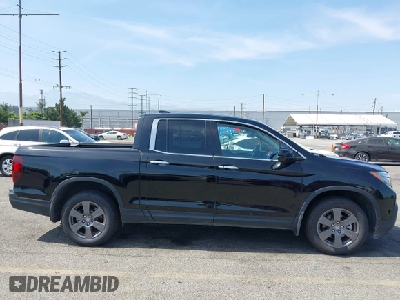2020 Honda Ridgeline RTL-E with VIN 5FPYK3F70LB009376, listed as a IAAI auction lot 42488529 with 30,932 mi miles and . Bid and sale history available at DreamBid. Image 13.