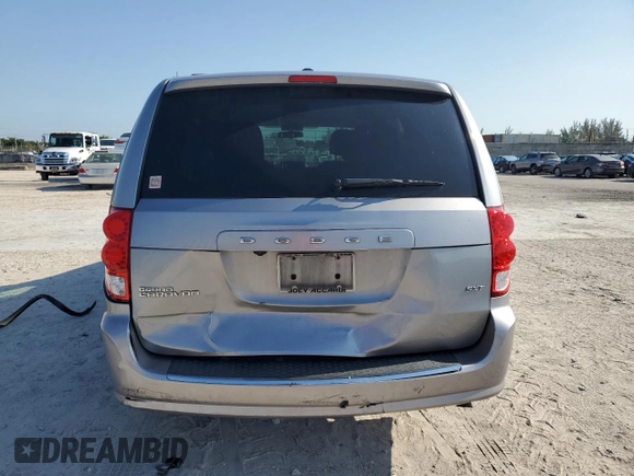 2014 Dodge Grand Caravan SXT z VIN 2C4RDGCG6ER223900, wystawiony jako Copart lot #56960965 z przebiegiem 101 275 mil mil oraz Szkoda całkowita • Salvage title. Historia ofert i sprzedaży dostępna na DreamBid. Obrazek 6.