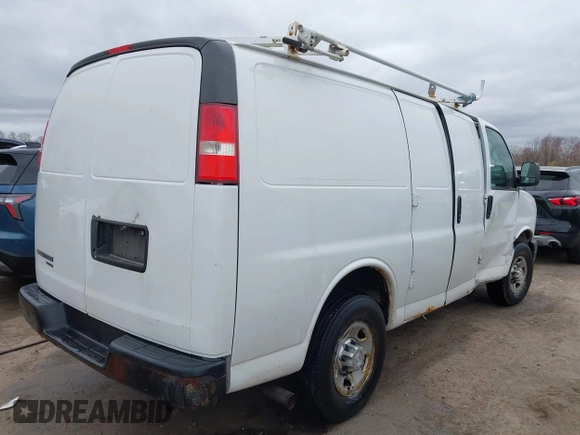 2015 Chevrolet Express Cargo Van with VIN 1GCWGFCFXF1259591, listed as a IAAI auction lot 42029679 with 144,023 mi miles. Bid and sale history available at carsss.com. Image 4.