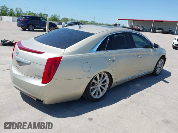 2014 Cadillac XTS Premium with VIN 2G61P5S33E9157607, listed as a IAAI auction lot 42004612 with 111,047 mi miles and . Bid and sale history available at DreamBid. Image 4.